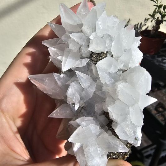 Snow White Calcite Specimen: Pyrite & Hematite Base, Chihuahua Mexico